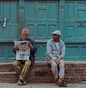 two-men-reading-newspaper