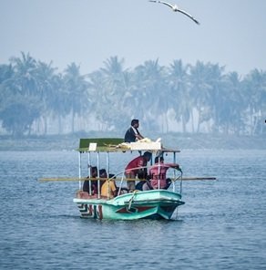 man-in-speed-boat